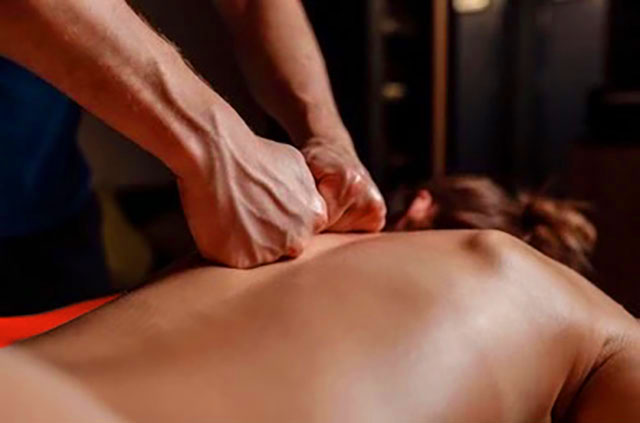 image of woman relaxing while having a massage